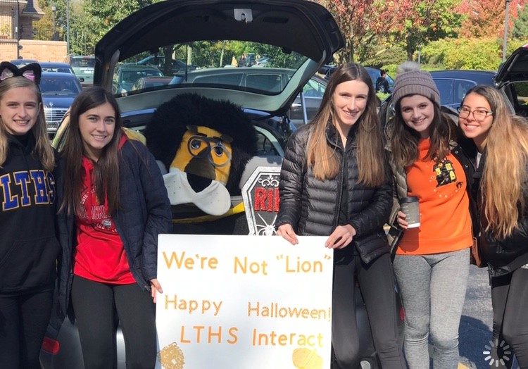 Interact club smiles for a photo at the trunk-or-treat event (photo courtesy of Maya Albores).