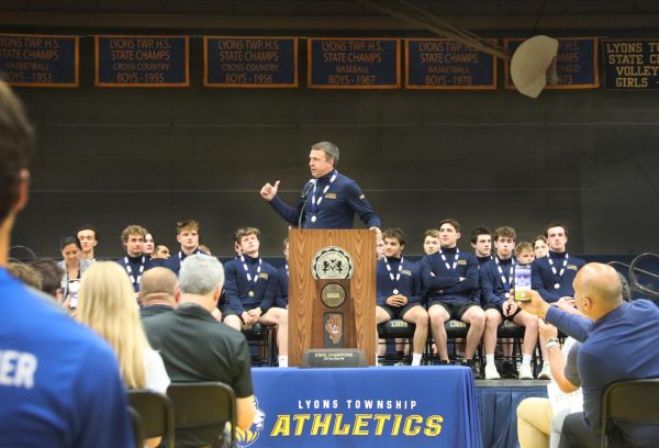 Head Coach Doug Eichstaedt addresses the school at NC on May 21 at the Water Polo State Championship assembly.
