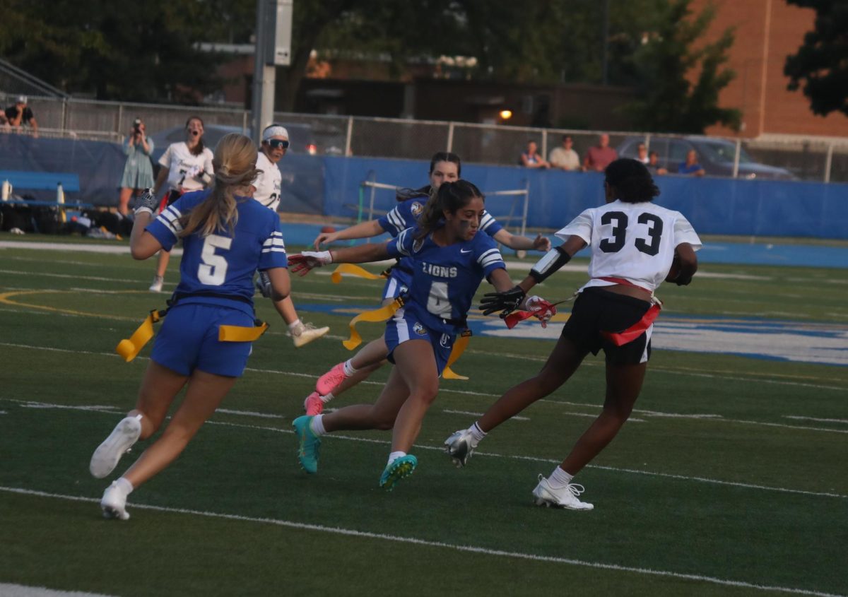 Jordyn Hoffenberg '25 pulls the flag from a Fenwick receiver after a catch