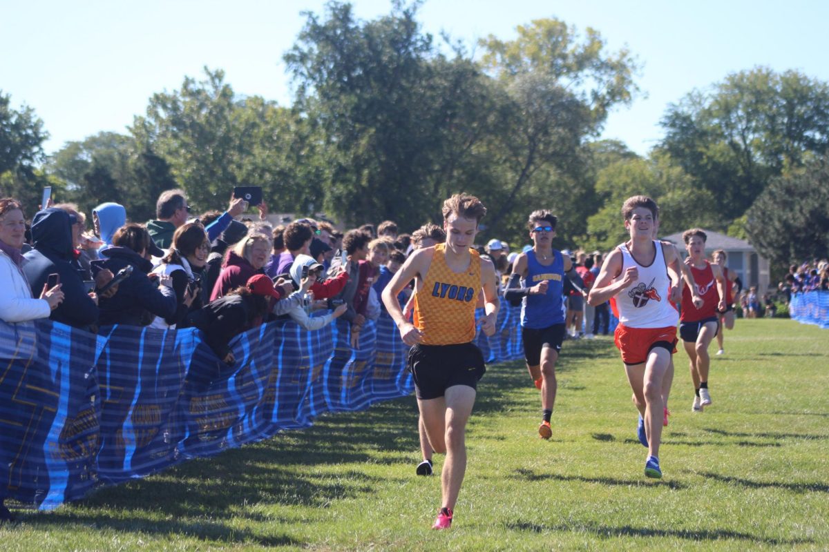 Benjamin Wuggazer '25 crosses finish line at Mike Kuharic Invitational on Sept. 7