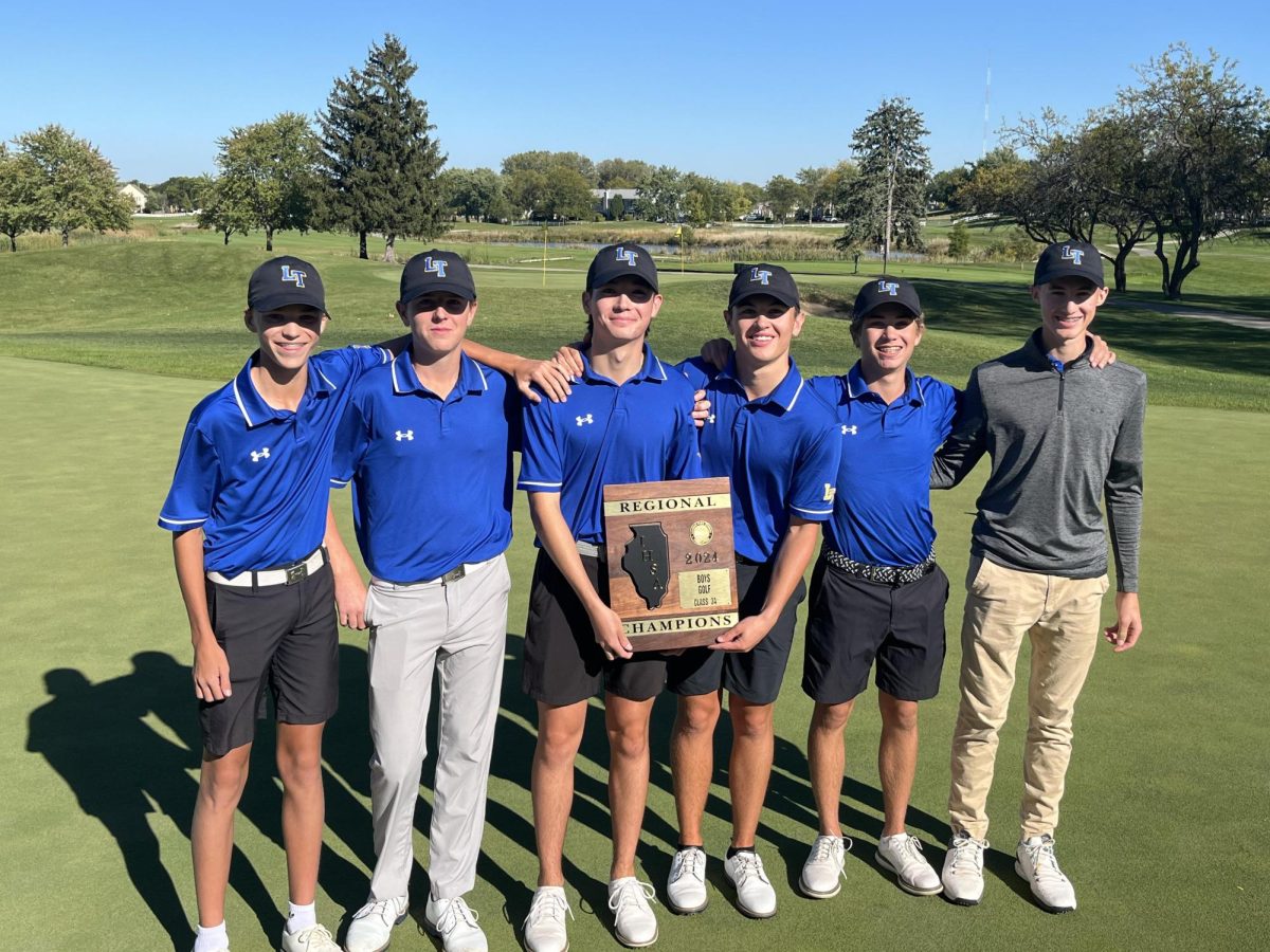 Boys golf team is shown at the Fox Run Golf Course after winning the regional championship (photo courtesy John Grundke). 