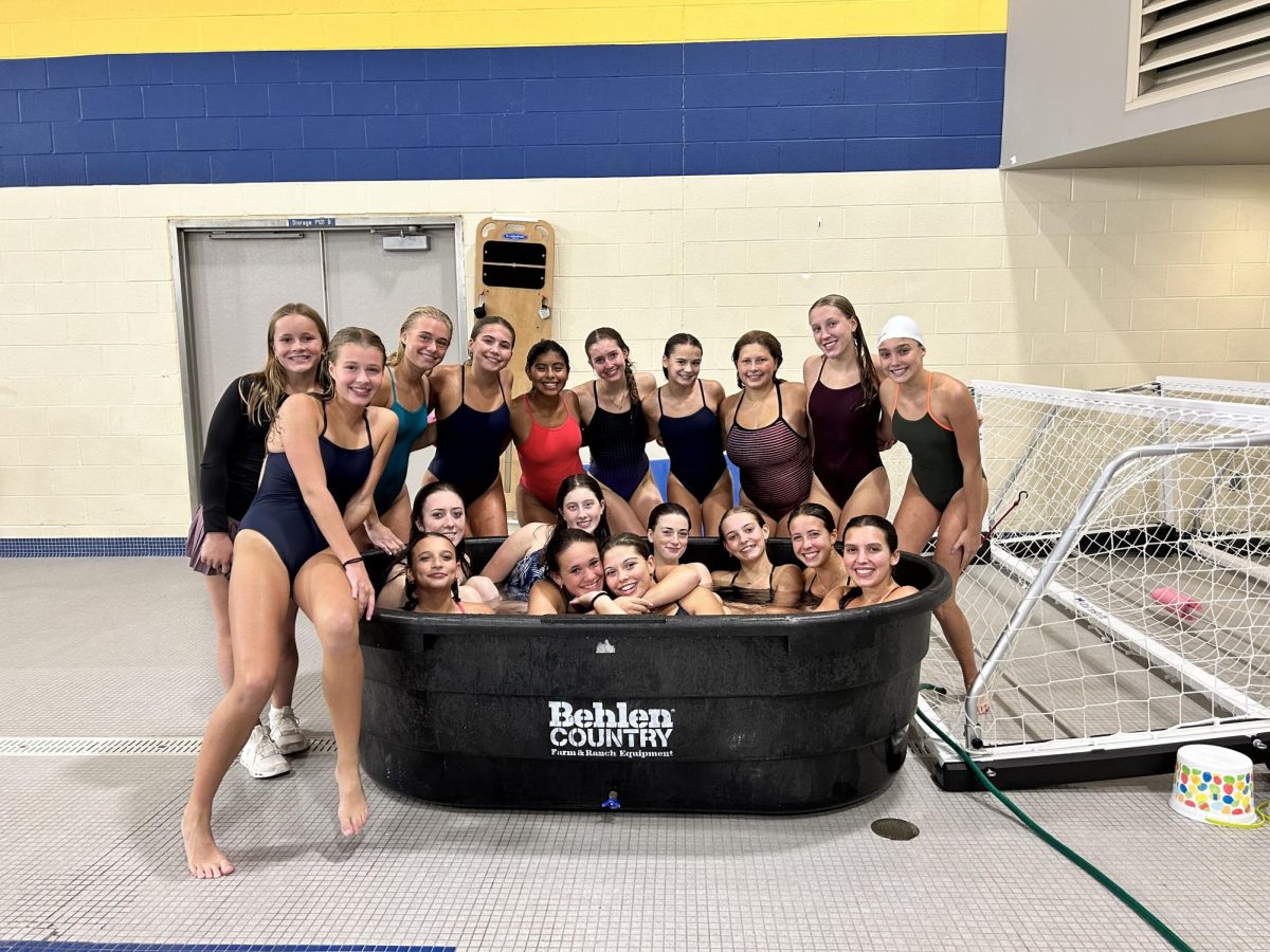 Girls dive team gathered in the horse bath hot tub before practice in October (courtesy of Julie McDermott)