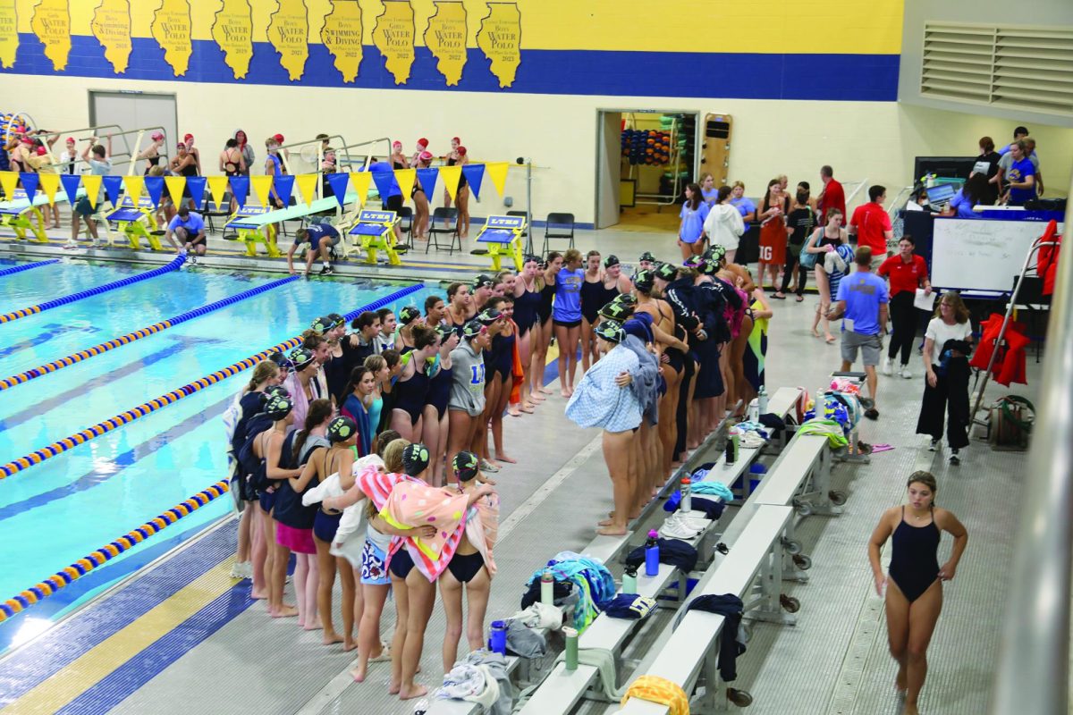 Girls swim team gathers during practice