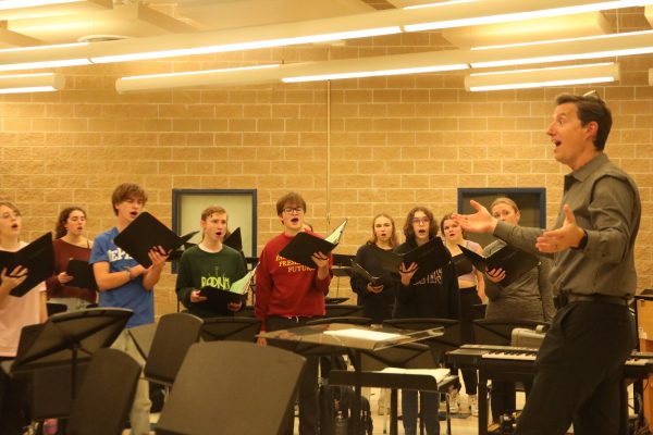 Choir members practice during fifth period for FanFares and Carols concert 