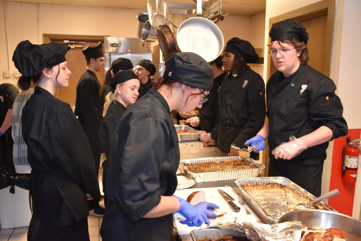 Chef students prepare to serve food to senior citizens of the community(photo courtesy of Randy Antlept).

