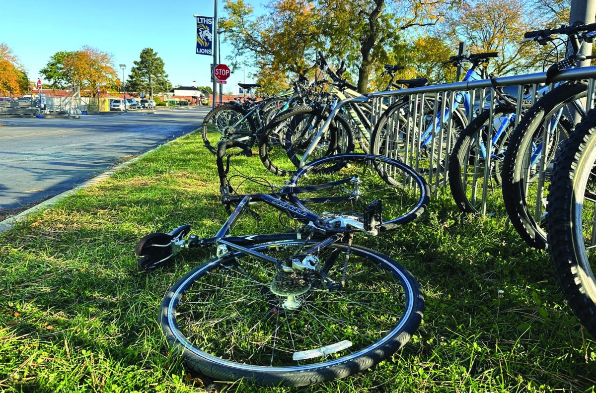 A student’s bike was left lying next to locked up bikes at the racks along the front parking lot at SC on Oct. 18 (LION).