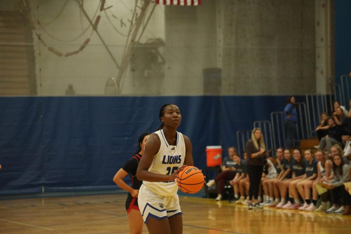 Nora Ezike '25 prepares to shoot a free throw in game against Benet Academy on Nov. 19 (D'Antonio/LION)