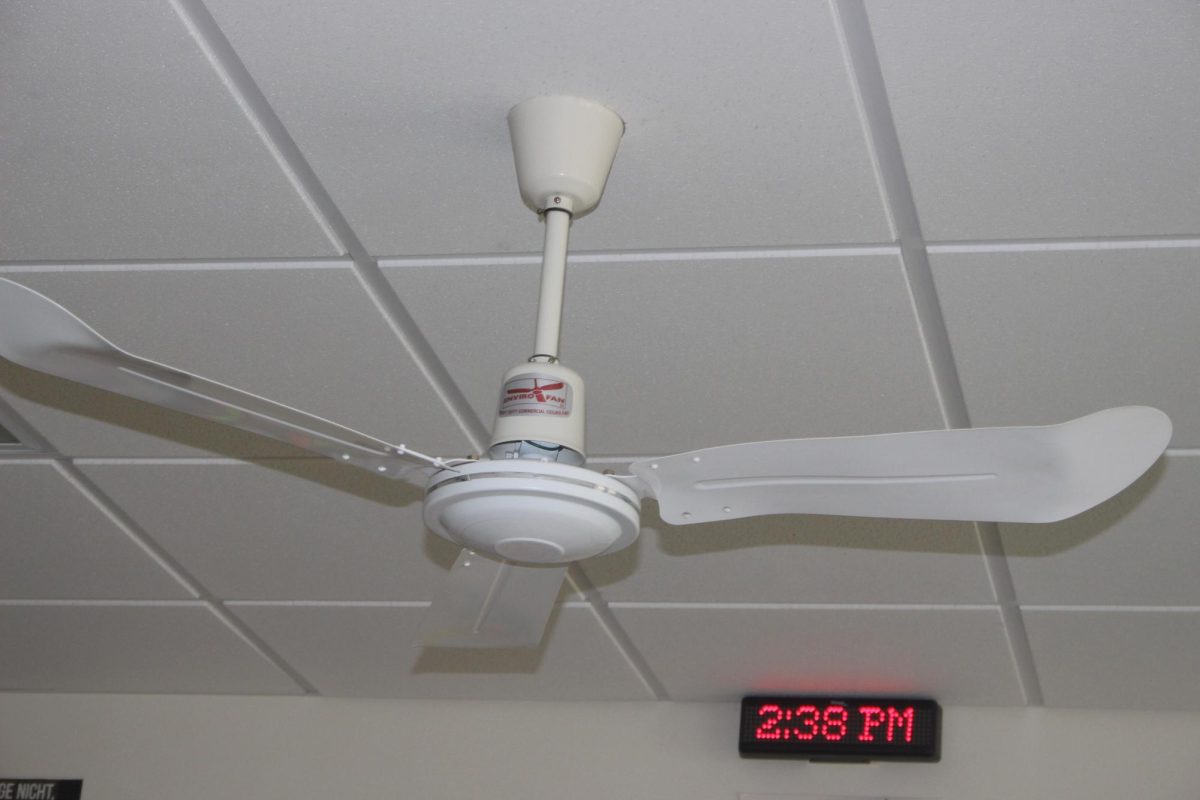 Fan in ASL classroom blocks message board from parts of the classroom