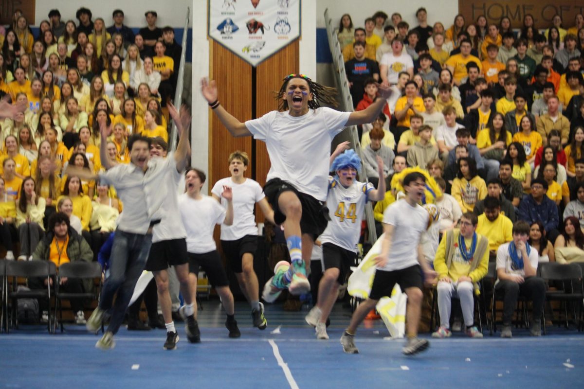 Mr. LT candidates run onto main stage on Feb. 7 during All School Assembly (Velez/LION).