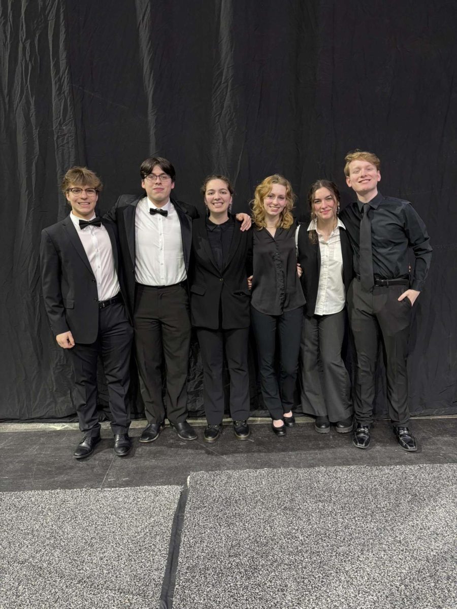 Nicholas Pabijan '25, Dylan Andrade '25, Corinna Morrissey '25, Agnes Kuchta '25, Audrey Tromp '27, and Thomas King '27 pose together at performance (photo courtesy of Agnes Kutcha)