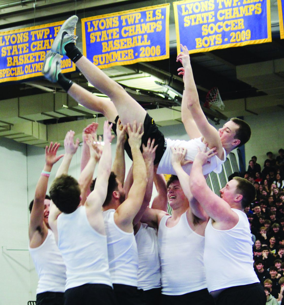 Football team finishes dance performance by hoisting Luke Karrigan ‘25 in the air on Feb. 7 at the All School Assembly (Velez/LION).