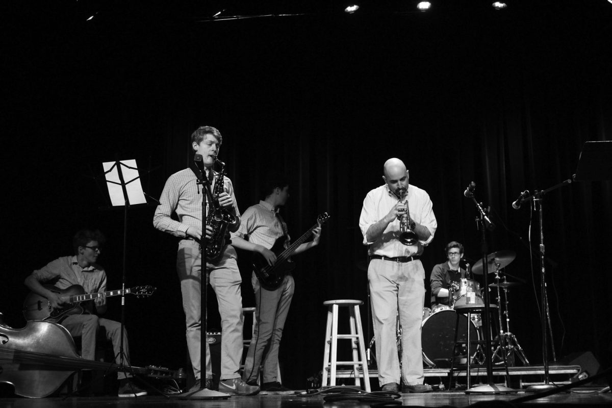 Archive from 2018: French teacher Sam Robinson joins a student band during Brownstock.