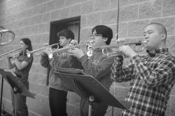 Jack Kraus '25, Dylan Andrade '25,  and Bradley Phan '26 practice 