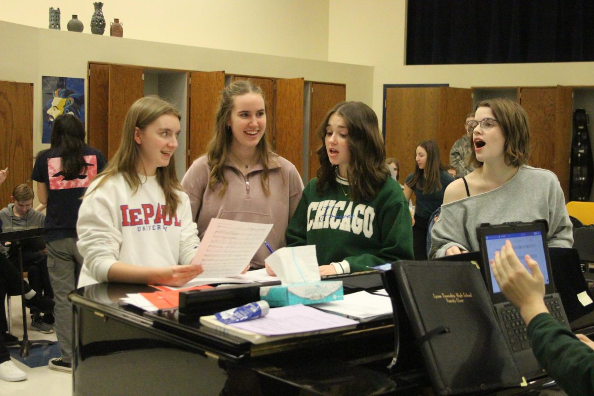 Tess Larmon’25 Abby Grech ’25 Jenna Eggerding ‘25 and Zoe Jaska ‘25 rehearse choral piece at practice for "Once Upon a Mattress" production on Feb. 3
