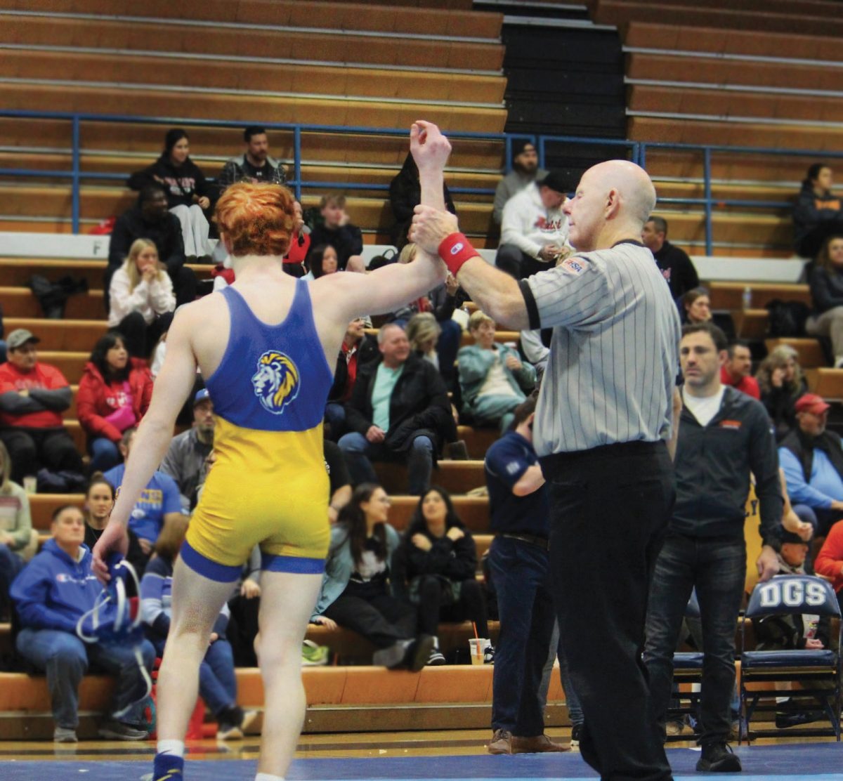 Griff Powell ‘26, a wrestler who won sixth in state for his weight class, won another match against a competing wrestler from the Chargers (Simmons/LION). 
