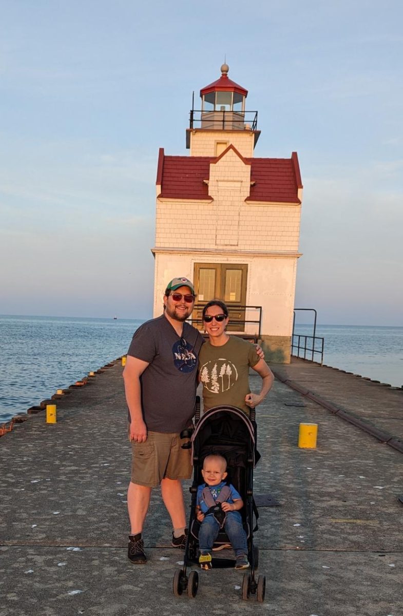 Brian Keller poses with his wife, Audrey Keller, and his son Bruce Keller, at a lighthouse near the lakehouse (photo courtesy A. Keller)